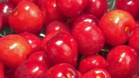 Fresh cherries rotating in plate Stock Footage 76466904