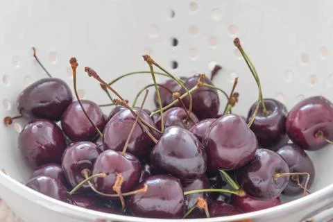 Fresh cherries in a sieve Stock Photos