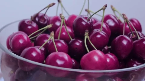 Fresh cherries spin on the plate. Stock Footage 77211900
