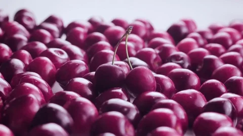 Fresh cherries on the white background. Two of them with branch Stock Footage 77212747