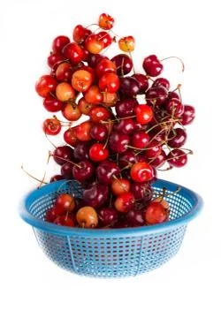 Fresh cherry with drops fall down Stock Photos