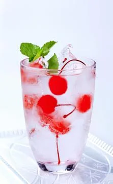 Fresh cherry lemonade with mint and ice cubes Stock Photos