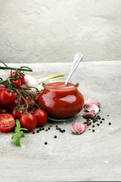 Fresh cherry tomato sauce on rustic background with cherry tomatoes Stock Photos