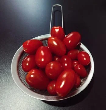 Fresh Cherry Tomato in Strainer Fotos de archivo