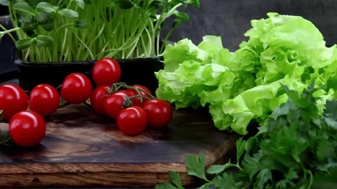 Fresh cherry tomatoes and crisp lettuce ready for a vibrant salad creation Vídeos de archivo 296313825