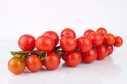 Fresh cherry tomatoes on the branch Stock Photos