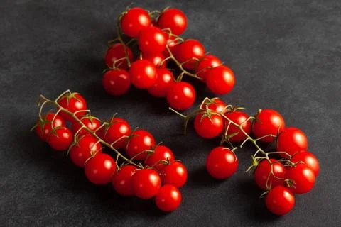 Fresh Cherry Tomatoes on Dark Background Stock Photos