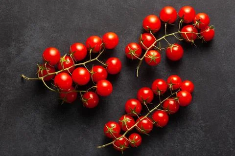 Fresh Cherry Tomatoes on Dark Background Stock Photos