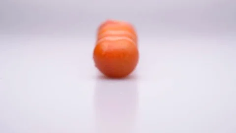 Fresh cherry tomatoes with drops one behind another dolly move - front Stock Footage 75575328