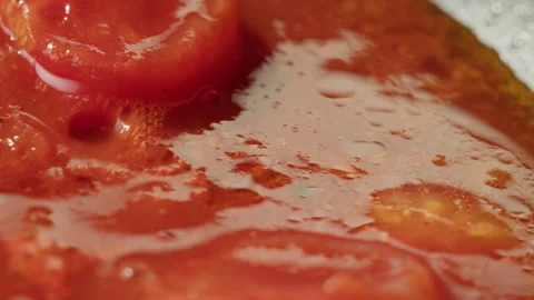 Fresh cherry tomatoes in a frying pan with olive oil and spices. Cooking tomato Stock Footage 258378621