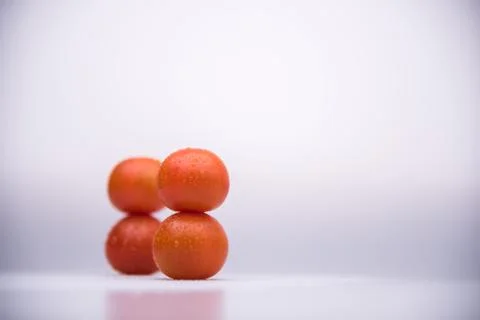 Fresh cherry tomatoes human shape isolated on white background cutout Stock Photos