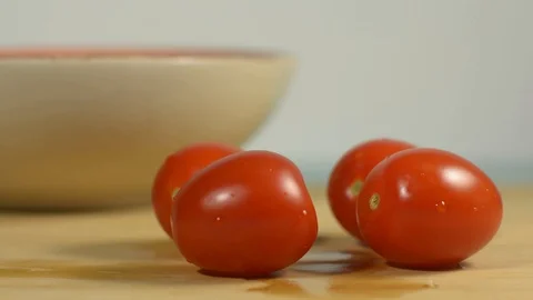 Fresh cherry tomatoes on the kitchen table Stock Footage 128917757
