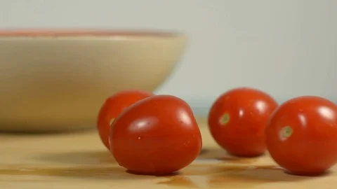 Fresh cherry tomatoes on the kitchen table Stock Footage 128917762