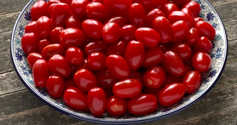 Fresh cherry tomatoes on a plate. Stock Footage 300949621