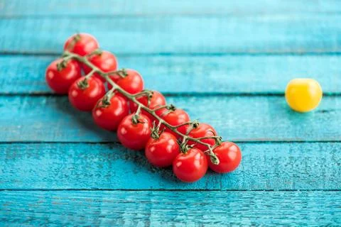 Fresh cherry tomatoes on table Stock Photos