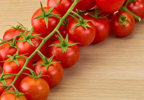 Fresh cherry tomatoes on the vine Stock Photos