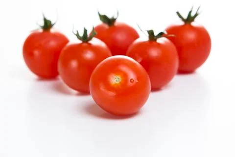 Fresh cherry tomatoes on a white background Stock Photos