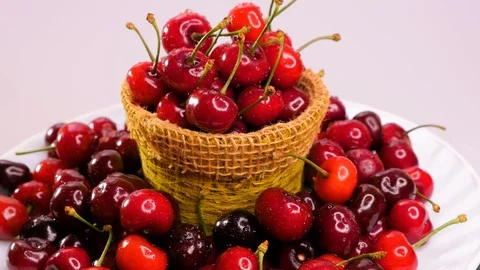Fresh cherry with water drops on a plate. Close up. Healthy food concept. Stock Footage 101583206