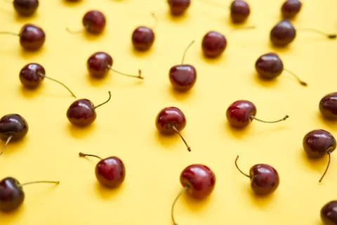 Fresh cherry on yellow background Stock-Fotos