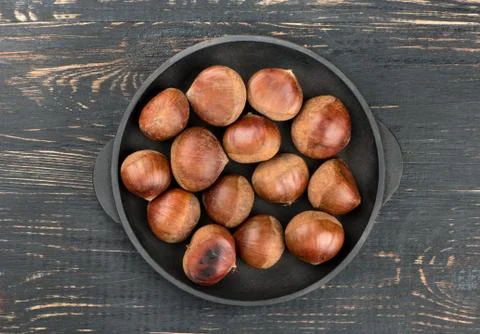 Fresh chestnuts in pan Stock Photos