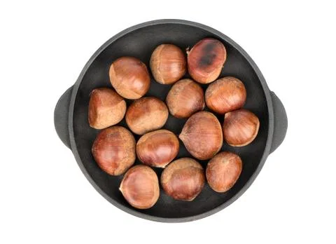 Fresh chestnuts in pan Stock Photos