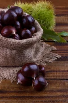Fresh chestnuts in a sack Stock Photos
