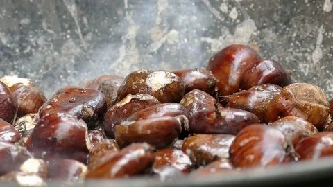 Fresh chestnuts in a wok Stock Footage 71491664
