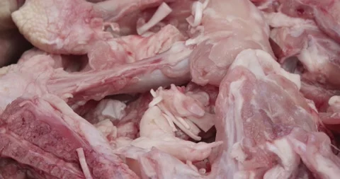 Fresh chicken bones for preparing a chicken stock Stock Footage 157385180