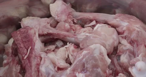 Fresh chicken bones for preparing a chicken stock Stock Footage 162251521