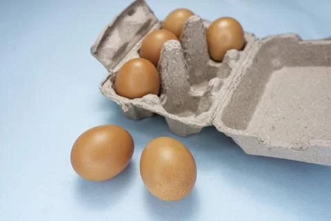 Fresh Chicken brown eggs on table Stock Photos