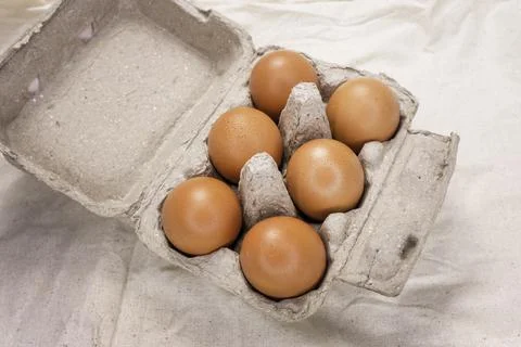 Fresh Chicken brown eggs on table Stock Photos