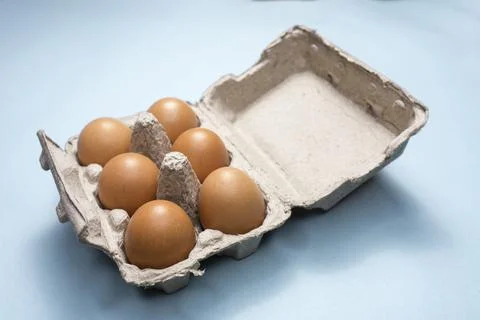 Fresh Chicken brown eggs on table Stock Photos