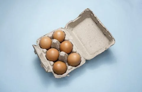 Fresh Chicken brown eggs on table Stock Photos