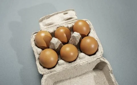 Fresh Chicken brown eggs on table Stock Photos