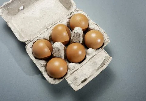 Fresh Chicken brown eggs on table Stock Photos
