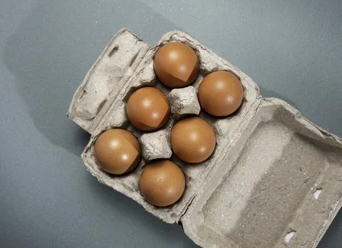 Fresh Chicken brown eggs on table Stock Photos