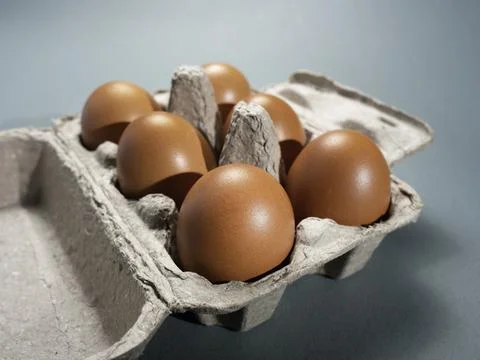 Fresh Chicken brown eggs on table Stock Photos