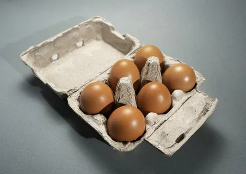 Fresh Chicken brown eggs on table Stock Photos