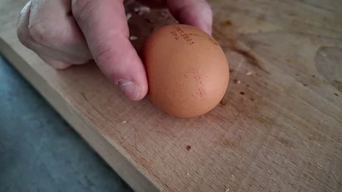 Fresh chicken egg presented before omelette preparation Video stock 347019982