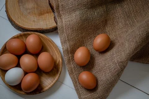 Fresh chicken eggs on the table, selective focus Stock Photos