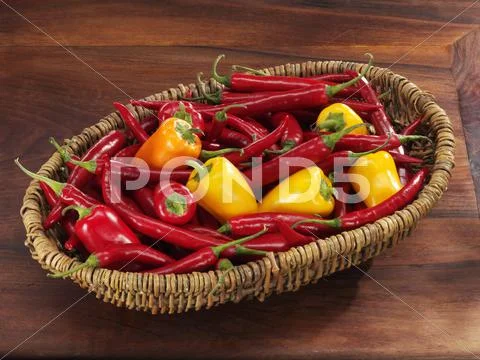 Fresh Chillies And Small Peppers In Basket