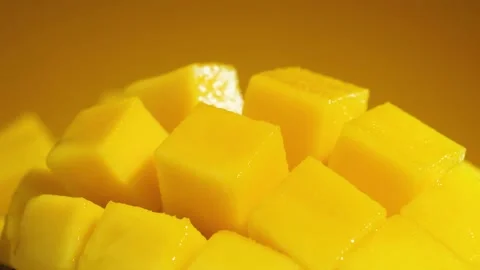 Fresh Chopped Mango cubes spinning slowly, Tropical fruit concept Stock Footage 200663157