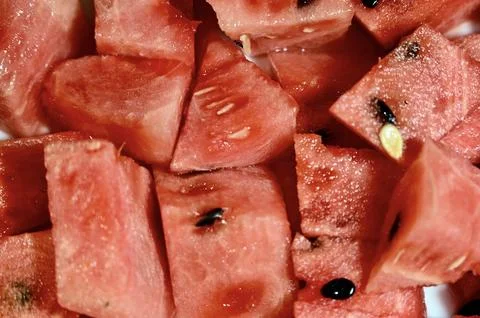 Fresh chunks of ripe red watermelon with black seeds Stock Photos