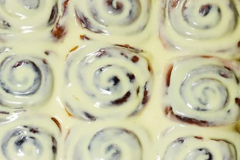Fresh Cinnamon Rolls Covered in Cream Cheese Icing Close-Up Tray of Frosted Bake Stock Photos