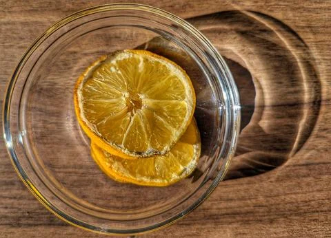 Fresh Citrus In Rustic Setting. Arrangement Of Lemon Wedges In Wooden Dish .. Stock Photos