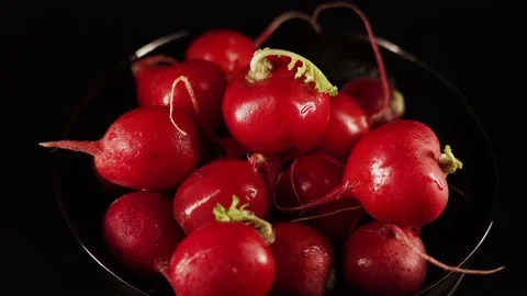 Fresh clean radish on black background rotation. Loop motion 4k Stock Footage 229235809