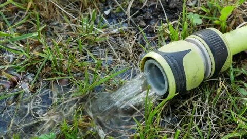 Fresh clean water flowing through green plastic pipe Stock Footage 308181676
