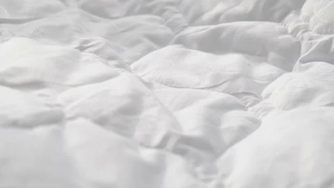 Fresh, clean white bedding after washing, close-up Video stock 220130541