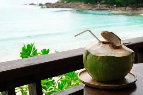 Fresh coconut with beach background on summer Foto stock