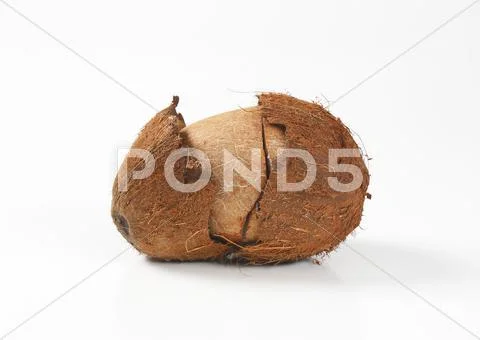 Fresh coconut with cracked husk Stock Photos
